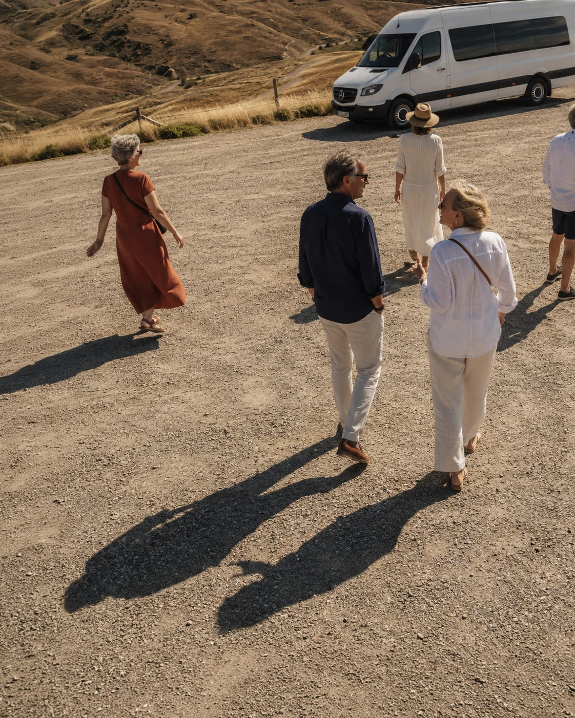 Montago guests walking toward a van in Otago.